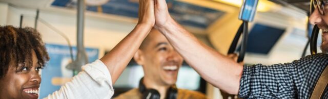 Two employees giving high five satisfying relationship agreement rules