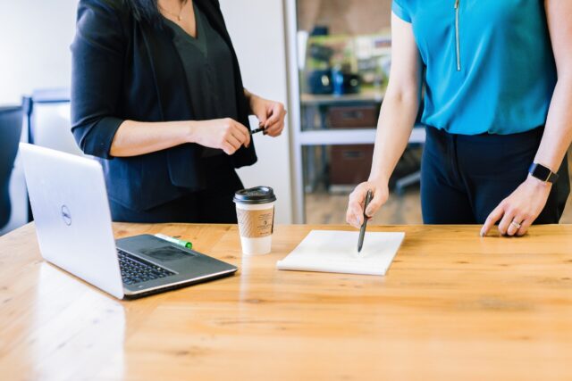 Two transformational leaders talking at work