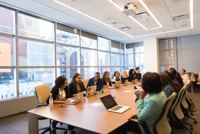 Workplace Meeting in conference room discussing elements of an inclusive work environment