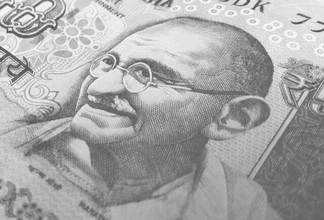 Black and white image of Ghandi on Indian rupee