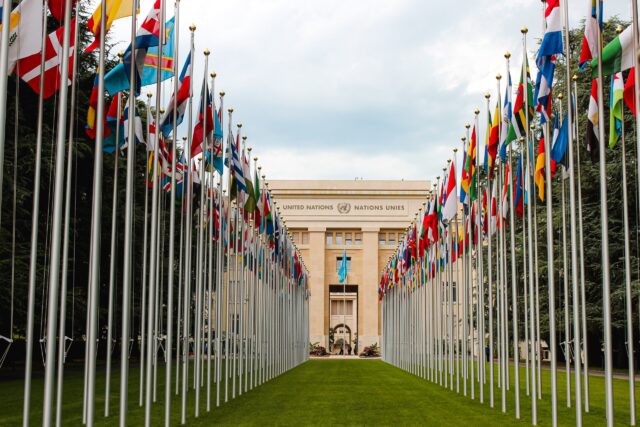 United Nations building with international flags representing an unbiased third-party