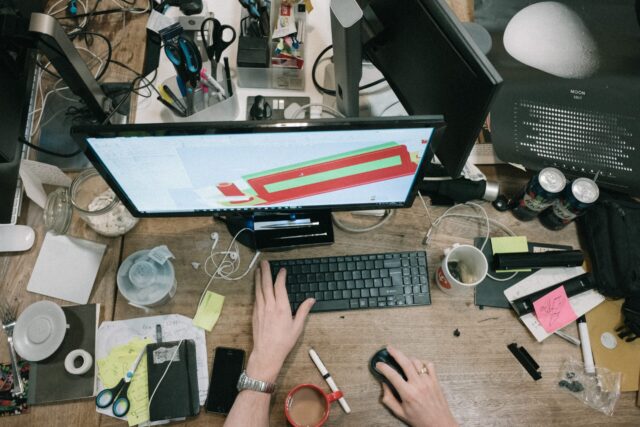 A cluttered desk with good employee productivity