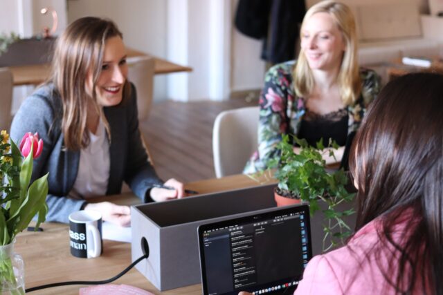 Colleagues sitting across a table