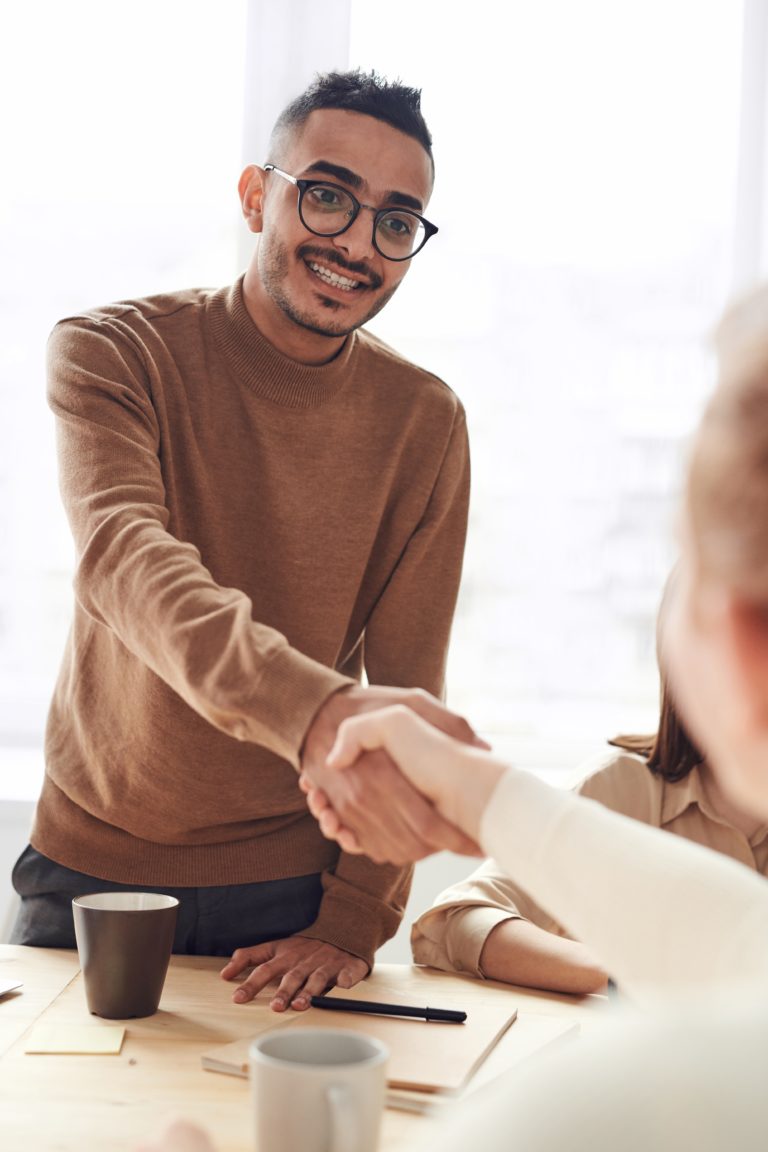 Man shaking employee hand in good communication