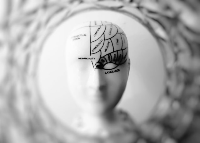 Image of figure with brain suggesting implicit association test