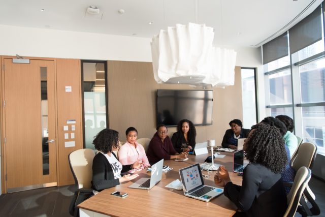 Employees at office in meeting about workplace reform