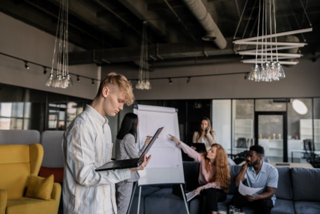 employees brainstorming benefits of workplace conflict