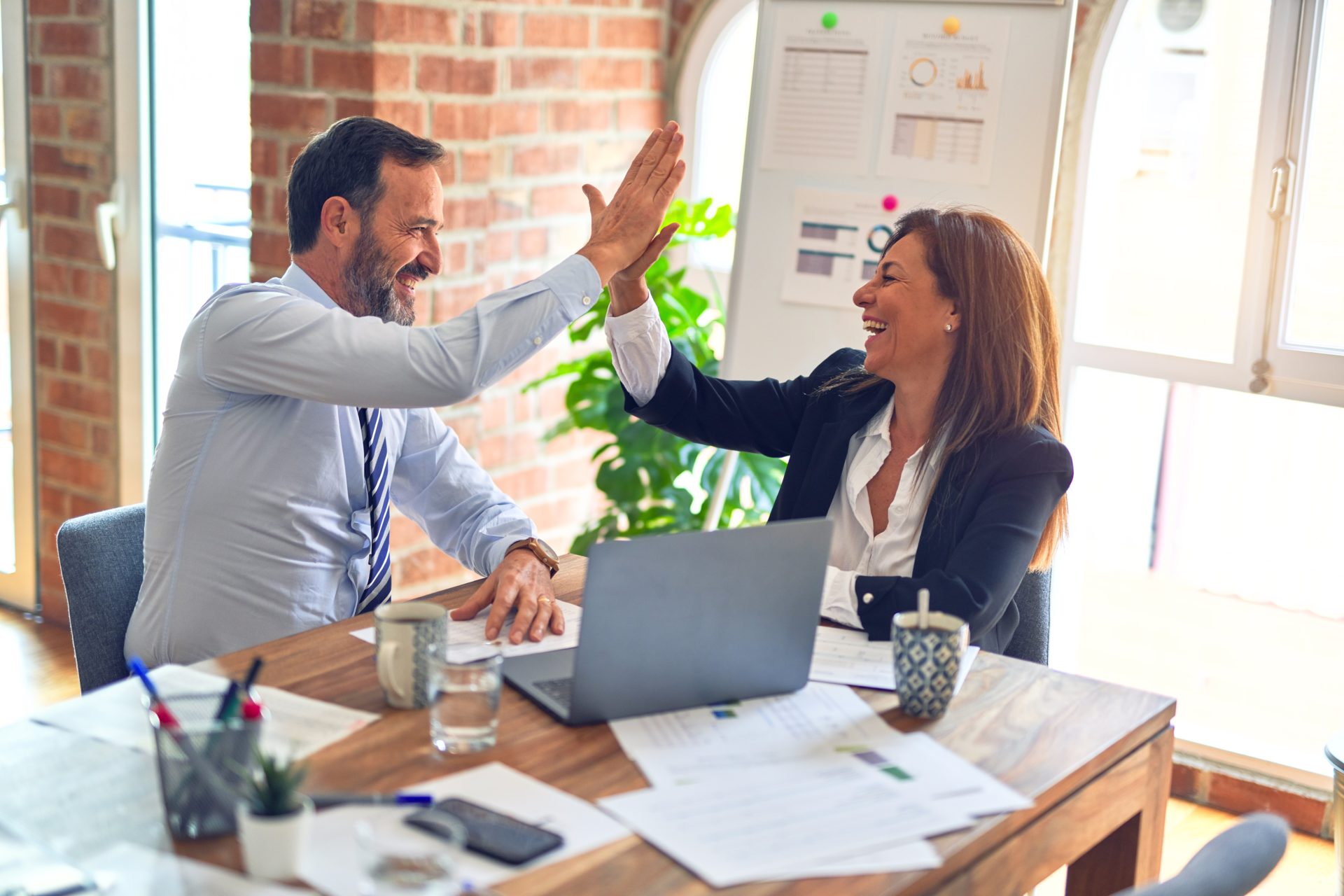 Two employees working through a coworker conflict with a mediator