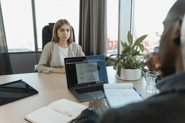 Woman Being Interviewed By A Man