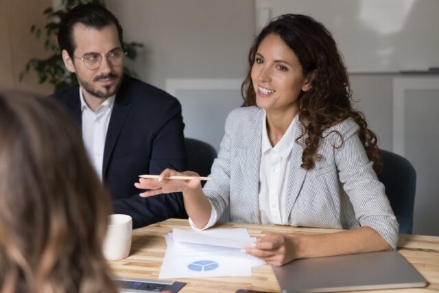 An employee engaging to speak up during a meeting