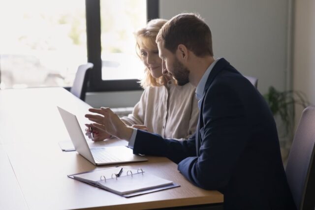 An employee engaging to help out a colleague