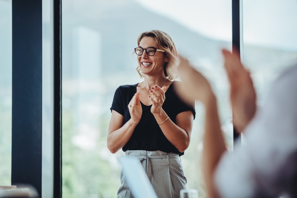 Motivated female employee in black blouse