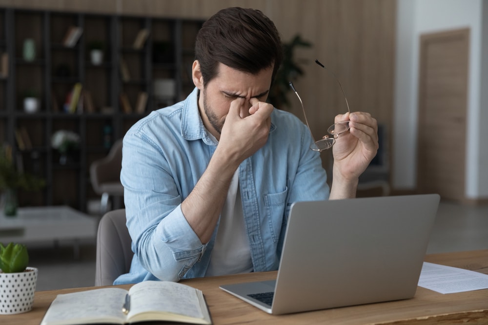 Burned out man at his workspace