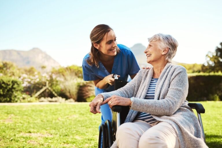 Conflict Resolution for the Healthcare Industry Nurse talking to an elderly patient outside in sunny weather