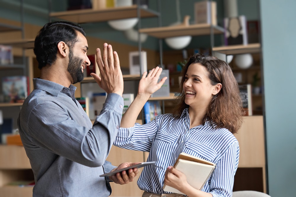 Business partners giving a high-five to each other