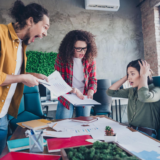 HR professional facilitating a conversation between employees during a workplace conflict