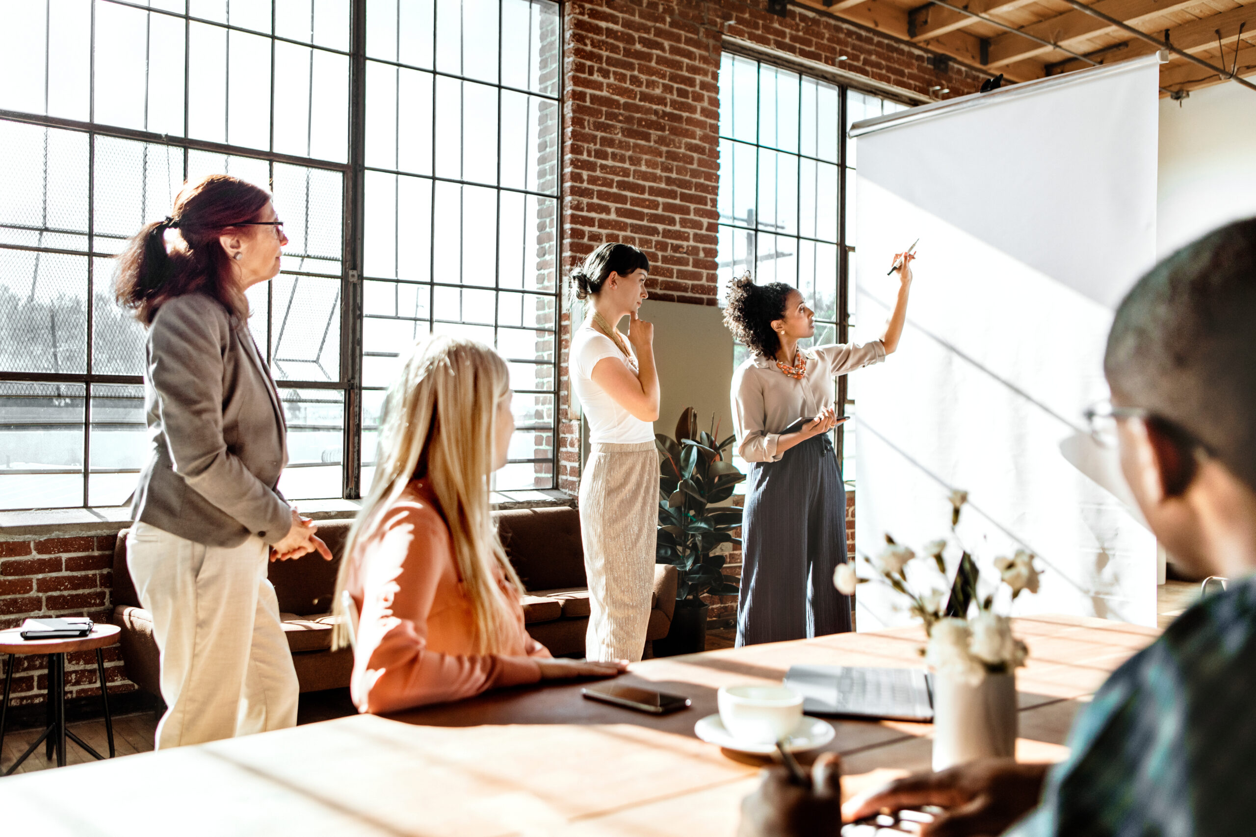 Business team working together https://pollackpeacebuilding.com/wp-content/uploads/2026/09/AdobeStock_340497457-scaled.jpeg